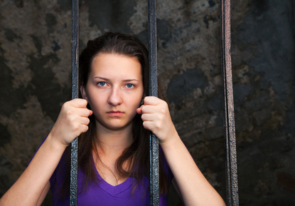 Young woman behind jail bars needing DWI bail bonds in Livingston