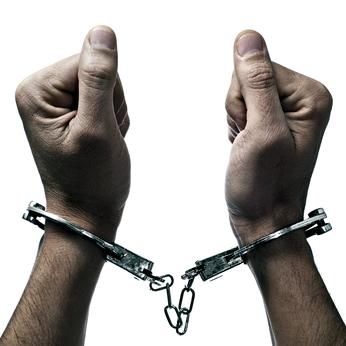 Handcuffed hands needing felony bail bonds in Liberty