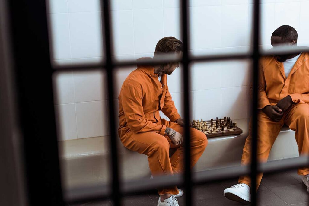 Inmates in a jail cell waiting for local bail bonds in Sharpstown