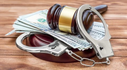 Gavel, handcuffs and cash for bail bond loans in Pearland