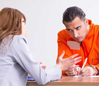 Inmate discussing bail bonds with a bail bondsman in Katy