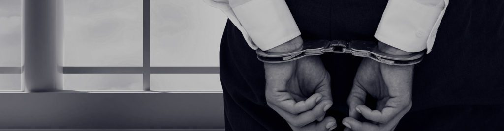 Handcuffed man needing a local bail bondsman in Pearland
