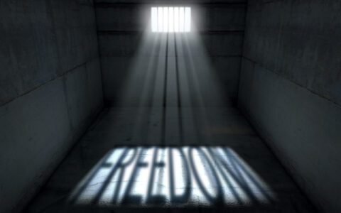Jail cell light spelling freedom through a bail bondsman in Gulfton